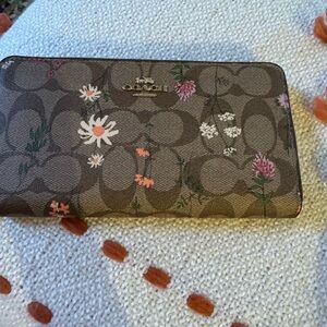 Brand new never used still in the gift box Coach wallet, satchel or clutch.